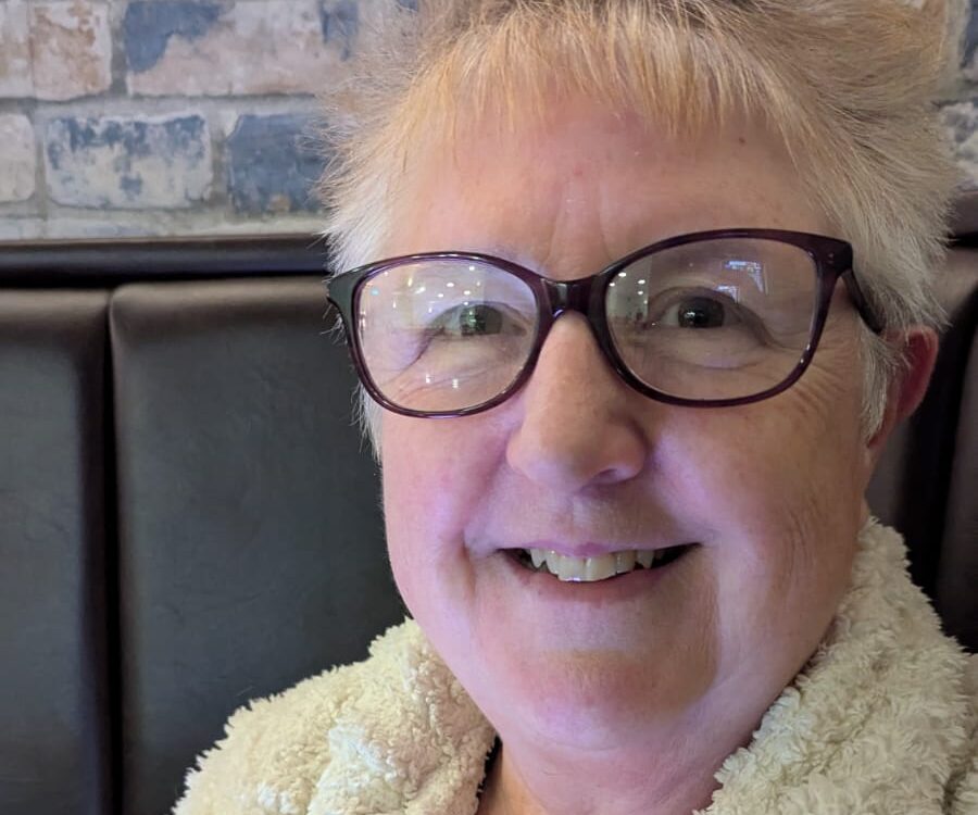 A picture of Donna, who has short blonde hair and glasses.